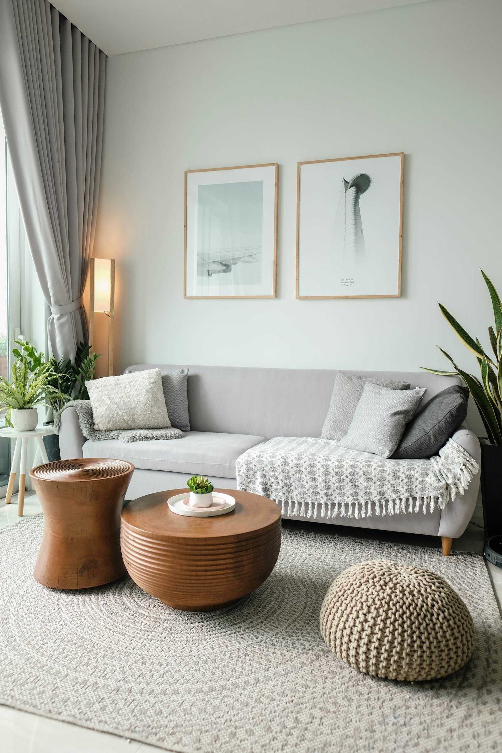 A tidy, well-staged rental living room with natural light